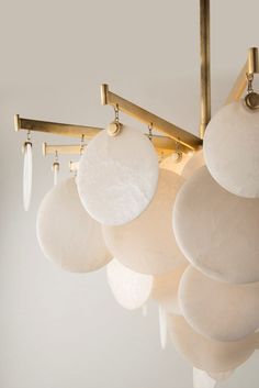 a chandelier with white balls hanging from it