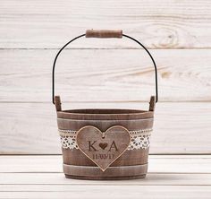 a wooden basket with a heart on it