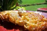 some food is sitting on a red plate with green grass in the backgroud