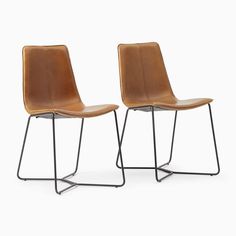 two brown chairs sitting next to each other on top of a white surface with metal legs