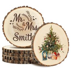 two personalized wooden coasters with a christmas tree and presents on them, sitting next to each other