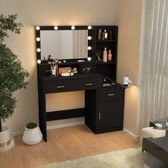 a black vanity with lights on it next to a potted plant and a mirror