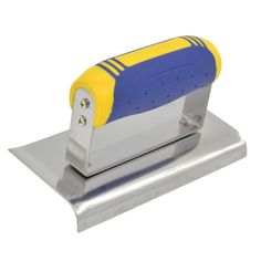 a blue and yellow stapler sitting on top of a metal plate