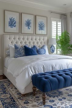 a bedroom with blue and white decor on the walls