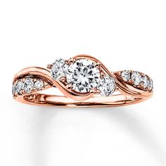 a rose gold engagement ring with two diamonds