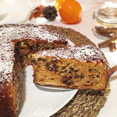 a cake on a plate with one slice cut out