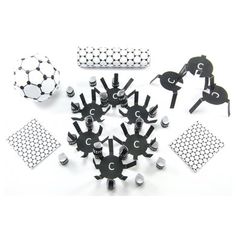 an assortment of metal objects on a white surface with black and white dots around them