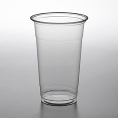 a clear plastic cup sitting on top of a table