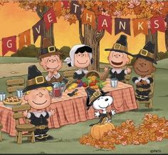 peanuts dressed as thanksgiving characters sitting at a table