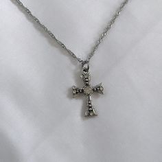 Gift your Catholic friend a stunning religious jewelry piece with this dainty silver cross necklace, perfect for women seeking minimalist elegance with a touch of charm from Silver Coquette Jewelry 𝐃𝐄𝐓𝐀𝐈𝐋𝐒:  ⭐️ Necklace lengths available: 14" 16" 18" & 20" ⭐️ Pendant size is 1" ⭐️ The silver cross charm is silver plated over alloy. The chain necklace is up on stainless steel, safe for sensitive skin ⭐️ Perfect for an everyday simple cross necklace, The Blessed cross necklace  ⭐️ ALL jewel Simple Cross Necklace, Vintage Cross Necklace, Cross Necklace Simple, Coquette Jewelry, Cross Charm Necklace, Silver Cross Necklace, Simple Cross, Jewelry Details, Silver Cross Pendant