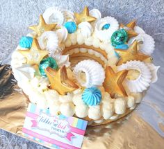 there is a cake decorated with shells and starfish