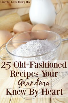 an old fashioned recipe in a glass bowl with eggs and flour on the table next to it