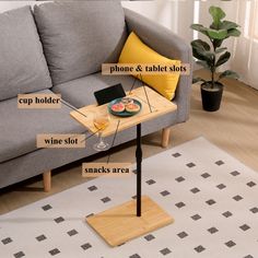 a living room with a couch, table and other items labeled on the coffee table