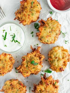 several crab cakes with ranch dressing on the side