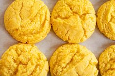 six cookies are arranged on a baking sheet