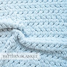 a blue blanket is laying on top of a white bed sheet with the words pattern blanket written across it