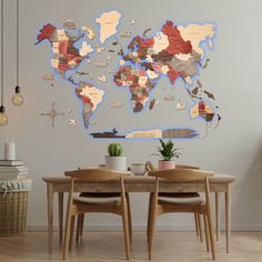 a map of the world is shown on a wall in a dining room with two chairs