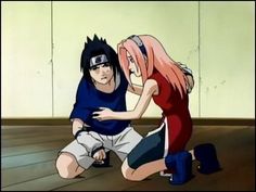 two anime characters are sitting on the floor and one is touching another's face