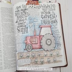 an open bible with a drawing of a tractor and words on the page in it