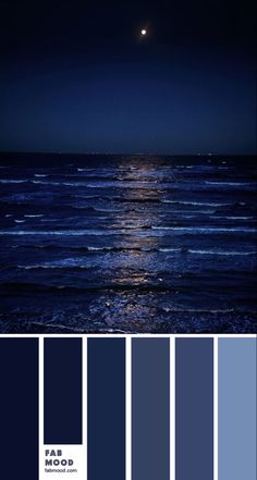 the moon is shining over the ocean at night with blue hues and dark colors