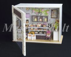 a doll house is set up to look like a bakery