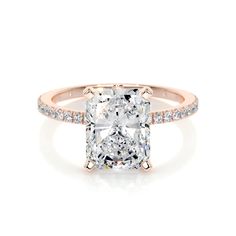 a cushion cut diamond ring with pave set shoulders