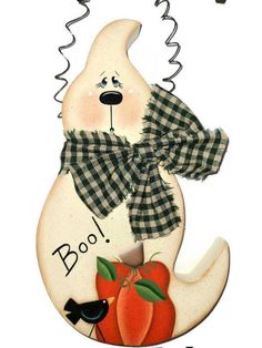 a ceramic sign with a dog wearing a bow and holding an apple in it's mouth