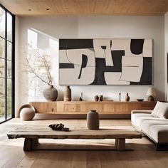 a living room filled with furniture and art