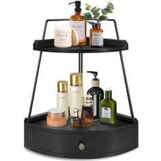 three tiered shelf with bottles, soaps and lotions on it in front of a white background