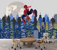 a spider man wall mural in a children's room