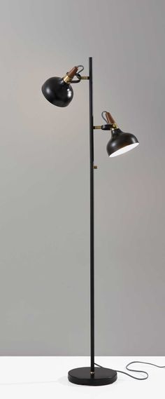 two black lamps with one light on each side and the other on top of it