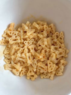 a white bowl filled with macaroni and cheese