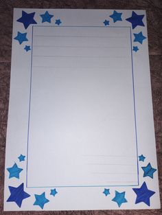 a sheet of paper with blue stars on the bottom and white sheets in the middle