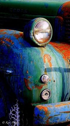 the front end of an old rusty truck