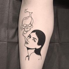 a woman with a skull on her leg