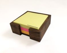 a small wooden desk with sticky notes attached to it