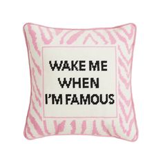 a pink and white pillow with the words wake me when i'm famous