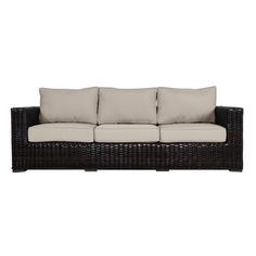 an outdoor sofa with cushions and pillows on the back, in front of a white background