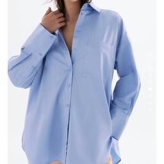 Oversized Fit Brand New With Tag Size Small Oversized Blue Shirt For The Office, Oversized Light Blue Shirt For Work, Oversized Blue Shirt For Work, Oversized Light Blue Shirt With Pockets, Oversized Blue Collared Blouse, Spring Blue Oversized Blouse, Oversized Blue Blouse For Work, Oversized Blue Blouse For Day Out, Blue Office Tops With Shirttail Hem