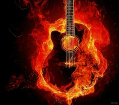 an acoustic guitar in flames on a black background