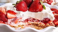 a close up of a pie with strawberries on top