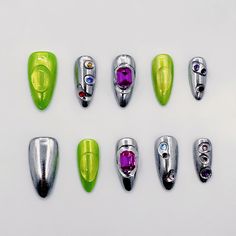 Futuristic silver and green press-on nails with colorful rhinestones. Handmade faux acrylic nails with a metallic, cutting-edge look. 🫰 Materials and Craftsmanship  High-quality 3D gel handmade, delicately hand-painted, with multi-element decorations. These sturdy, long-lasting luxury press-on nails are ones you can trust. 🚚 Free Shipping 📏 𝐒𝐢𝐳𝐞 -S: 15mm, 11mm, 12mm, 11mm, 9mm -M: 16mm,12mm,13mm,12mm, 10mm -L: 17mm, 13mm, 14mm, 13mm, 11mm If you need a custom size, just fill out the perso Silver And Green Nails, Nails Metal, Metal Nails, Beauty Make-up, Unique Nails, Rhinestone Designs, Style Change, Nail Art Decorations, Green Nails