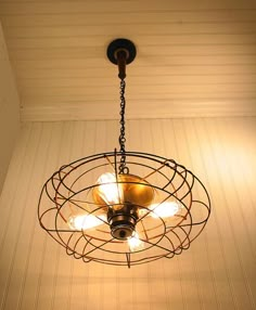 a chandelier hanging from the ceiling in a room