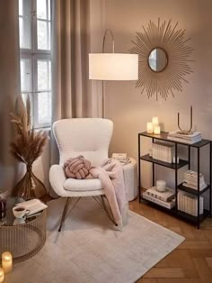 a white chair sitting next to a window in a living room