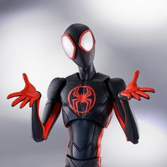 a close up of a person wearing a spider man suit with red gloves and hands