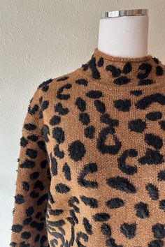 Product Details: Leopard pattern mock neck long sleeve sweater knit. Unlined. Knit. Midweight Wrangler Accessories, Leopard Print Sweater, Mock Neck Long Sleeve, Skirt Jumpsuit, Print Sweater, Top Graphic Tees, Leopard Pattern, Printed Sweater, Sweater Knit