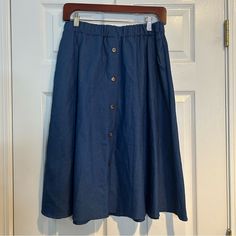 Nwt Charton Collection Denim Skirt Lightweight With Faux Buttons Down The Front Elastic Waist Says Size Xl, Fits More Like A Medium Casual Long Skirt With Button Closure, Dark Wash Button Skirt For Summer, Summer Blue Buttoned Denim Skirt, Blue Buttoned Denim Skirt For Summer, Denim Blue Button Skirt For Summer, Summer Denim Blue Skirt With Buttons, Blue Button-up Cotton Denim Skirt, Blue Cotton Button-up Denim Skirt, Cotton Skirt With Buttons In Medium Wash