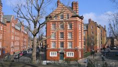 an old red brick building with many windows