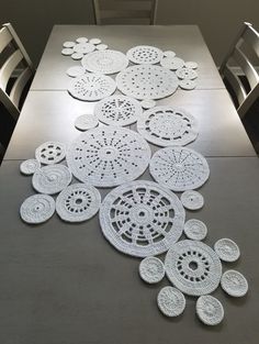 the table is covered with white crocheted doily