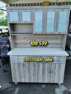 a wooden cabinet with glass doors and drawers